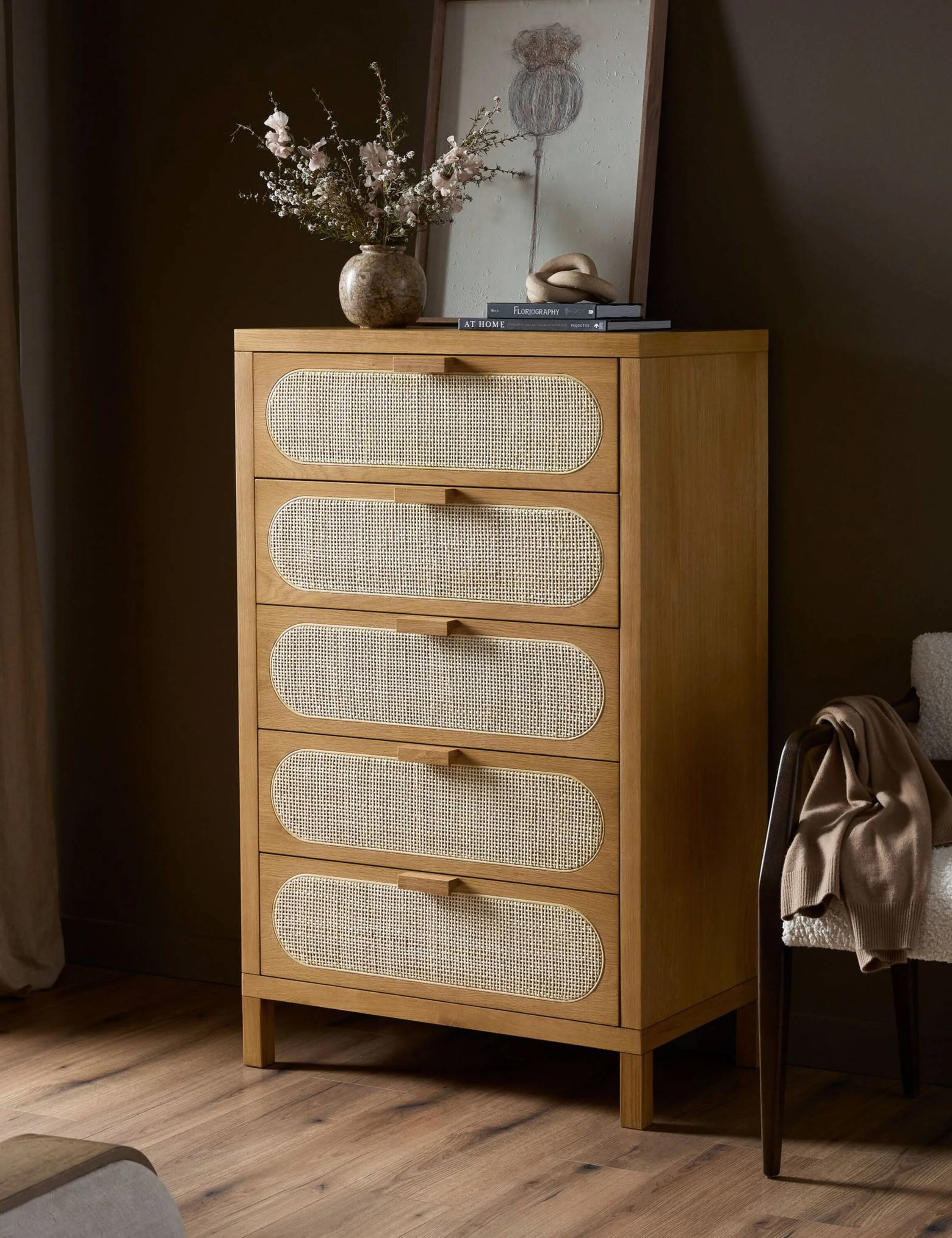 Dresser This wooden dresser brings transitional elements to the forefront of your bedroom, thanks to a wicker caned oval on each drawer front