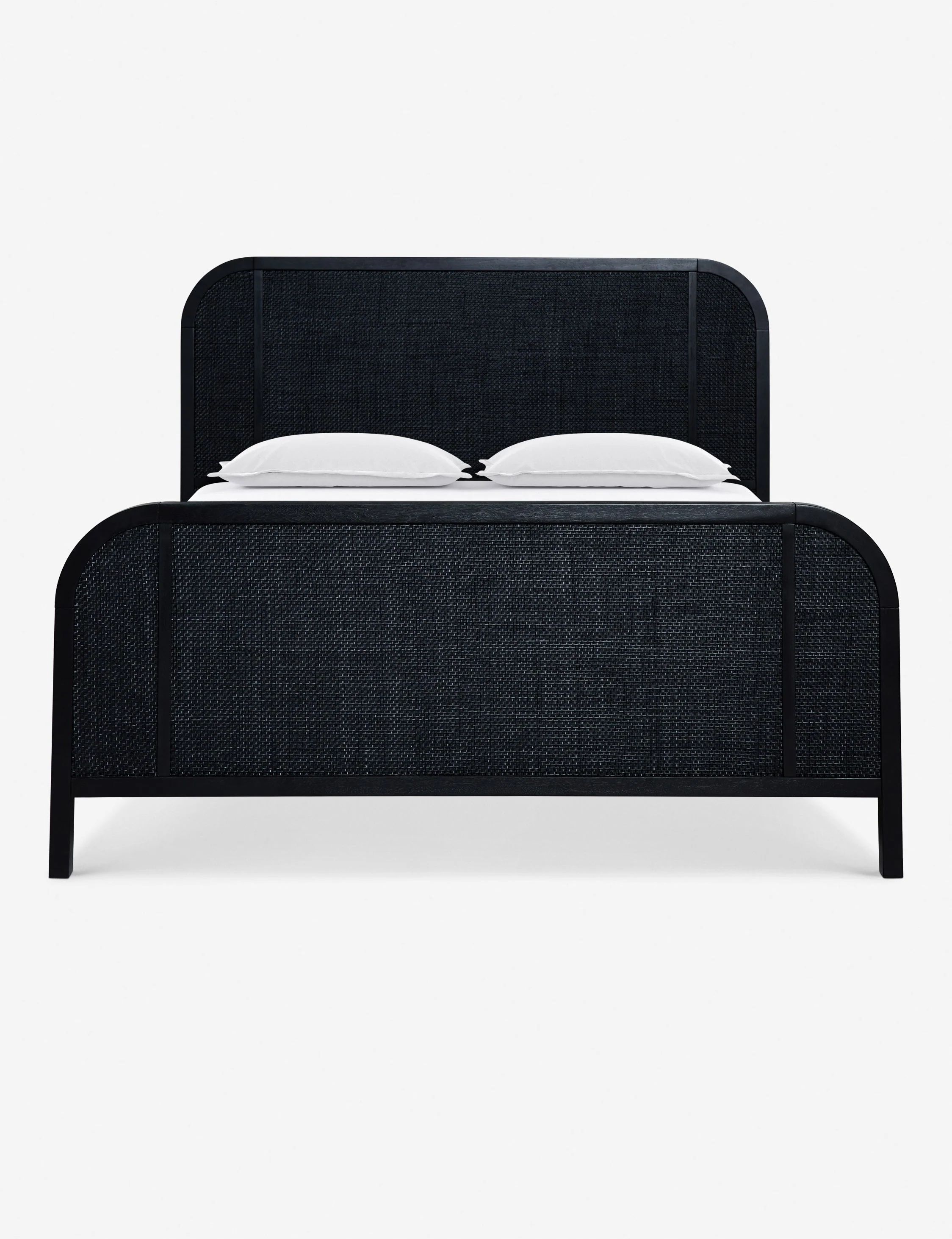 Bed This solid oak bed frame is grounded by curved lines set off by cane paneling at the foot and headboard. A whitewashed finish warmly