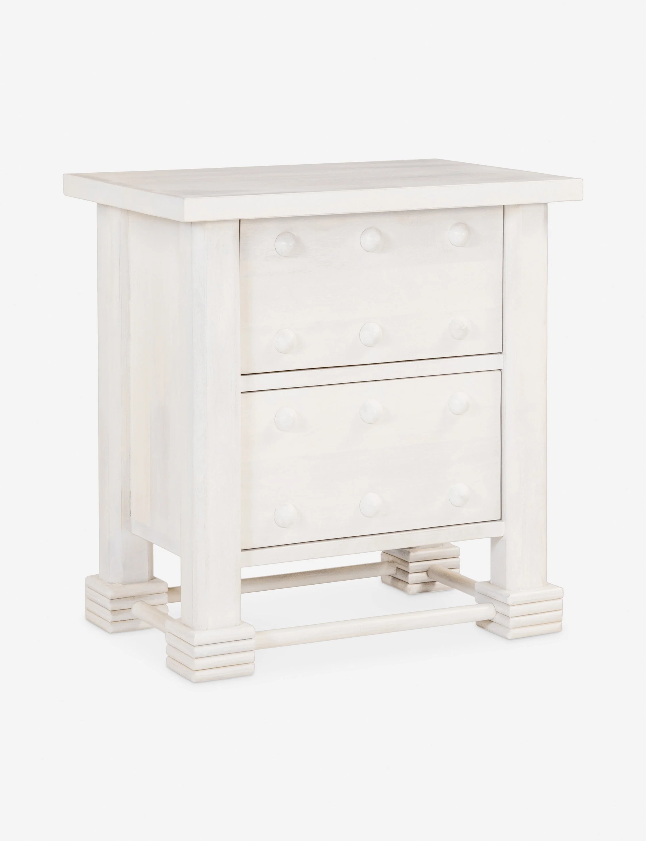 Nightstand - The nightstand cuts a chunky silhouette with French styling and knob motifs