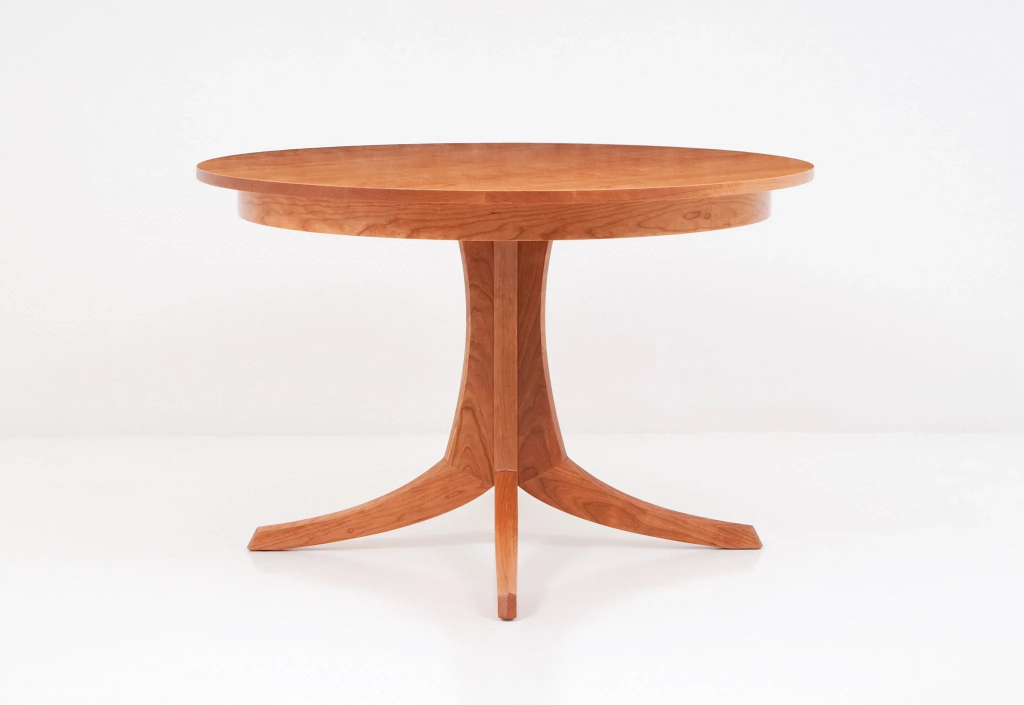 Table - Single Pedestal - The rests atop an innovative hardwood base that splays in four directions to provide strength