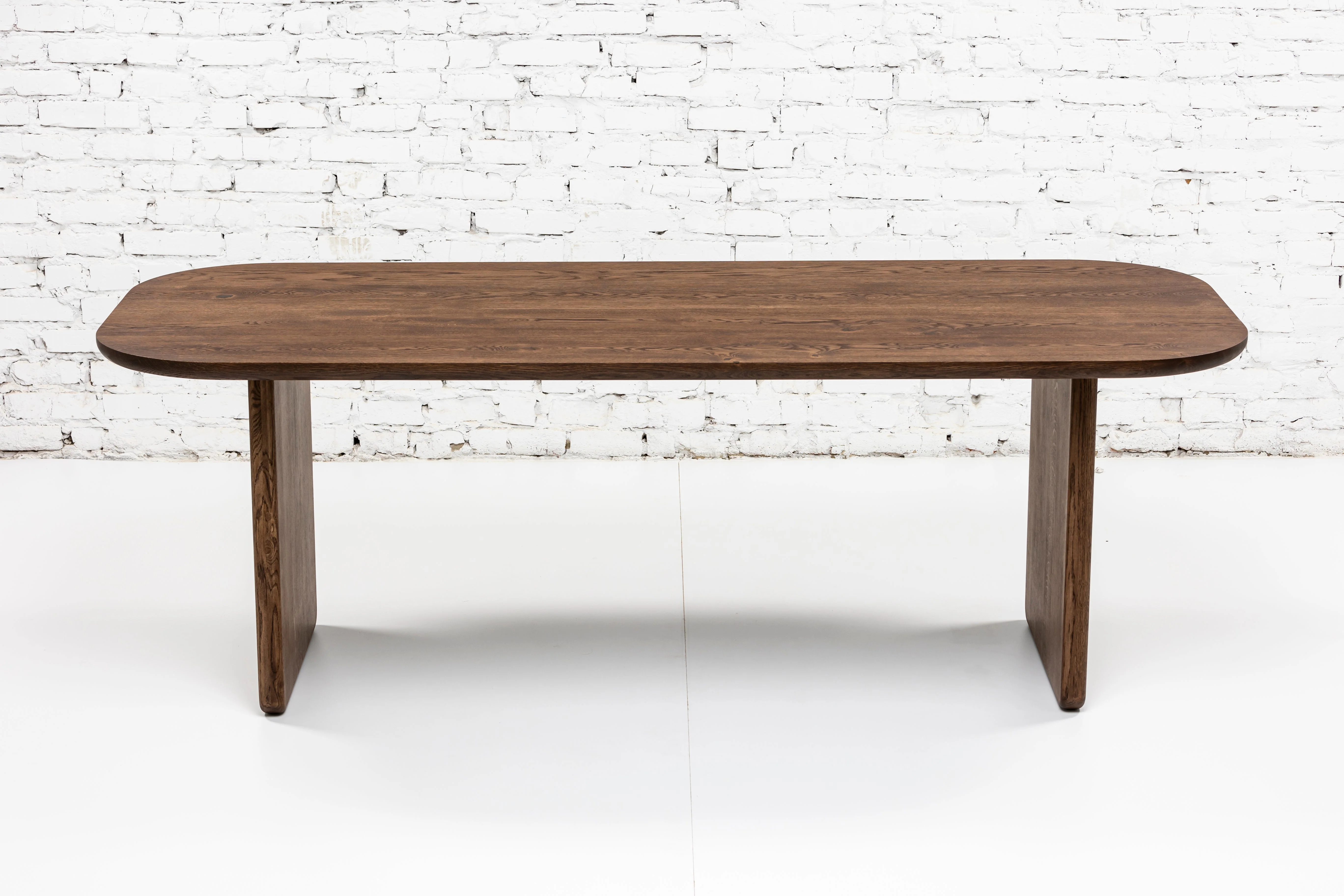 Chocolate Dark Oak Dining Table - Introducing the solid oak table in chocolate colour - a piece that seamlessly blends the serene charm of rural life