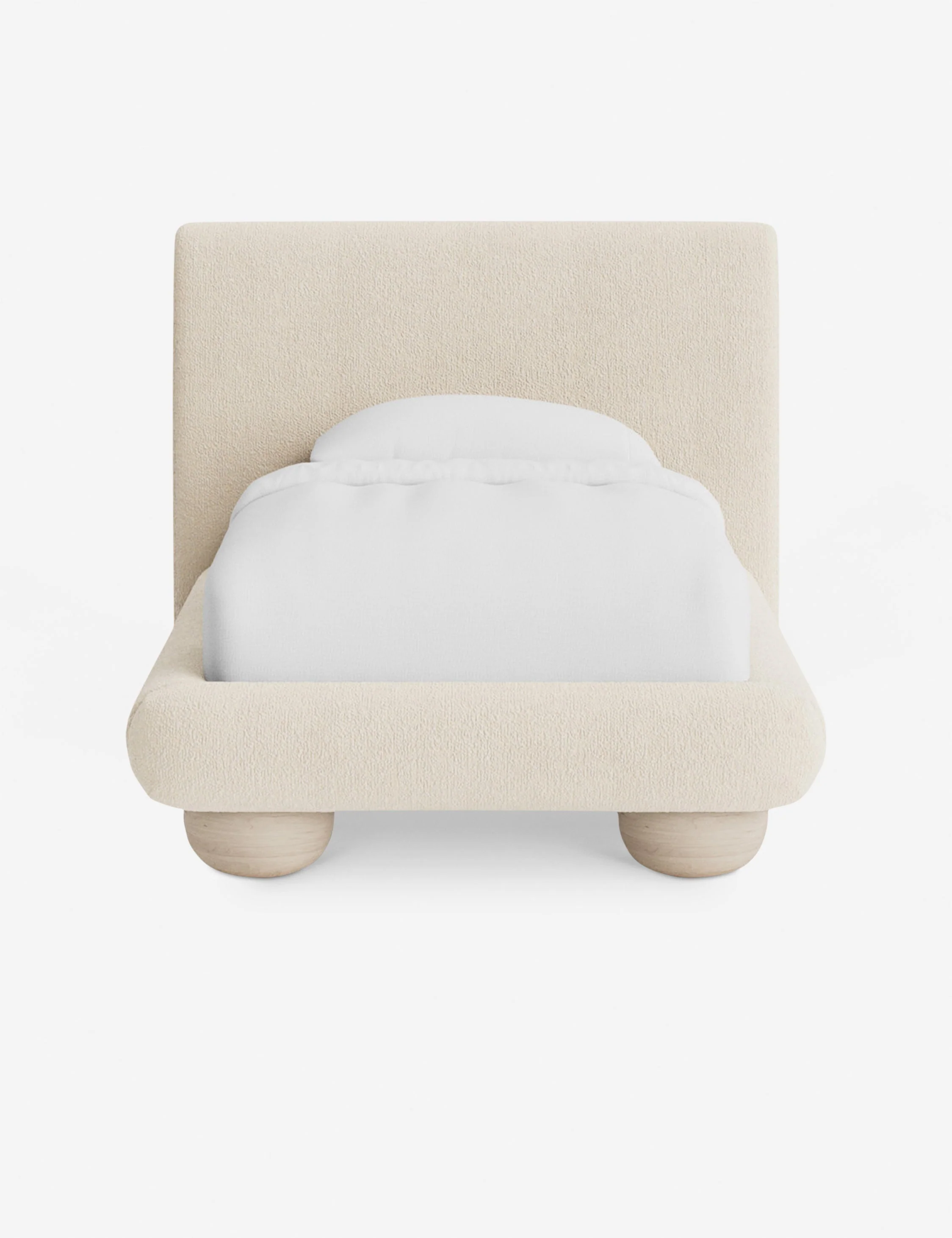 Bed Soft lines bring a modern silhouette to the bed. Oversized bun feet float the upholstered bed frame with a grounding touch of light wood grain