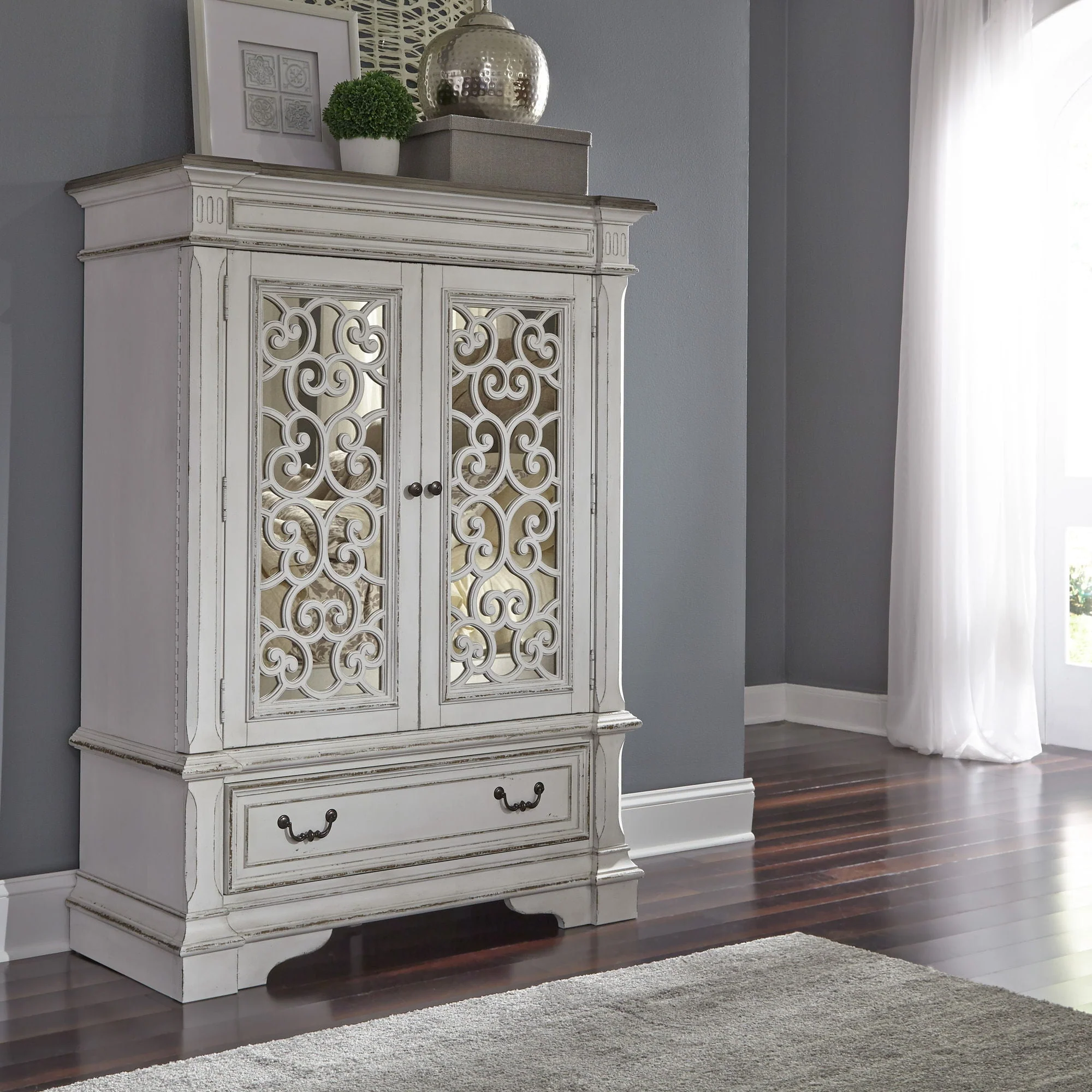 Mirrored Door Chest - Antique White — Bail and drop ring hardware in antique pewter add the finishing touch to the cases