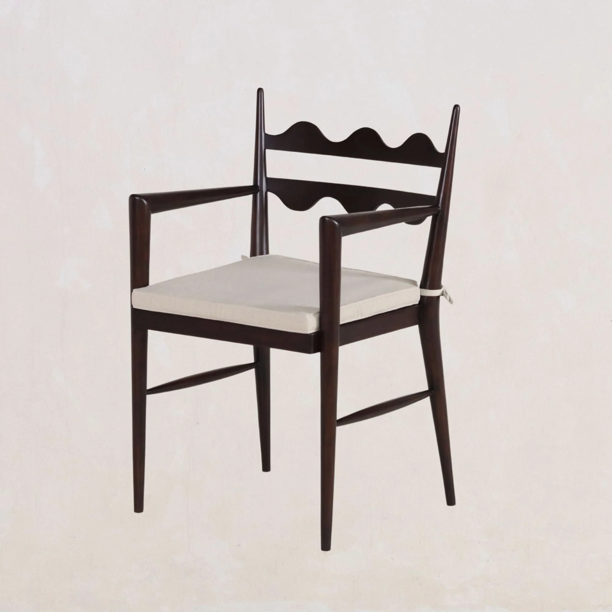 Armchair - The signature ladder-back with dual horizontal slats creates an immediate visual impact, while clean, tapered legs and a refined...