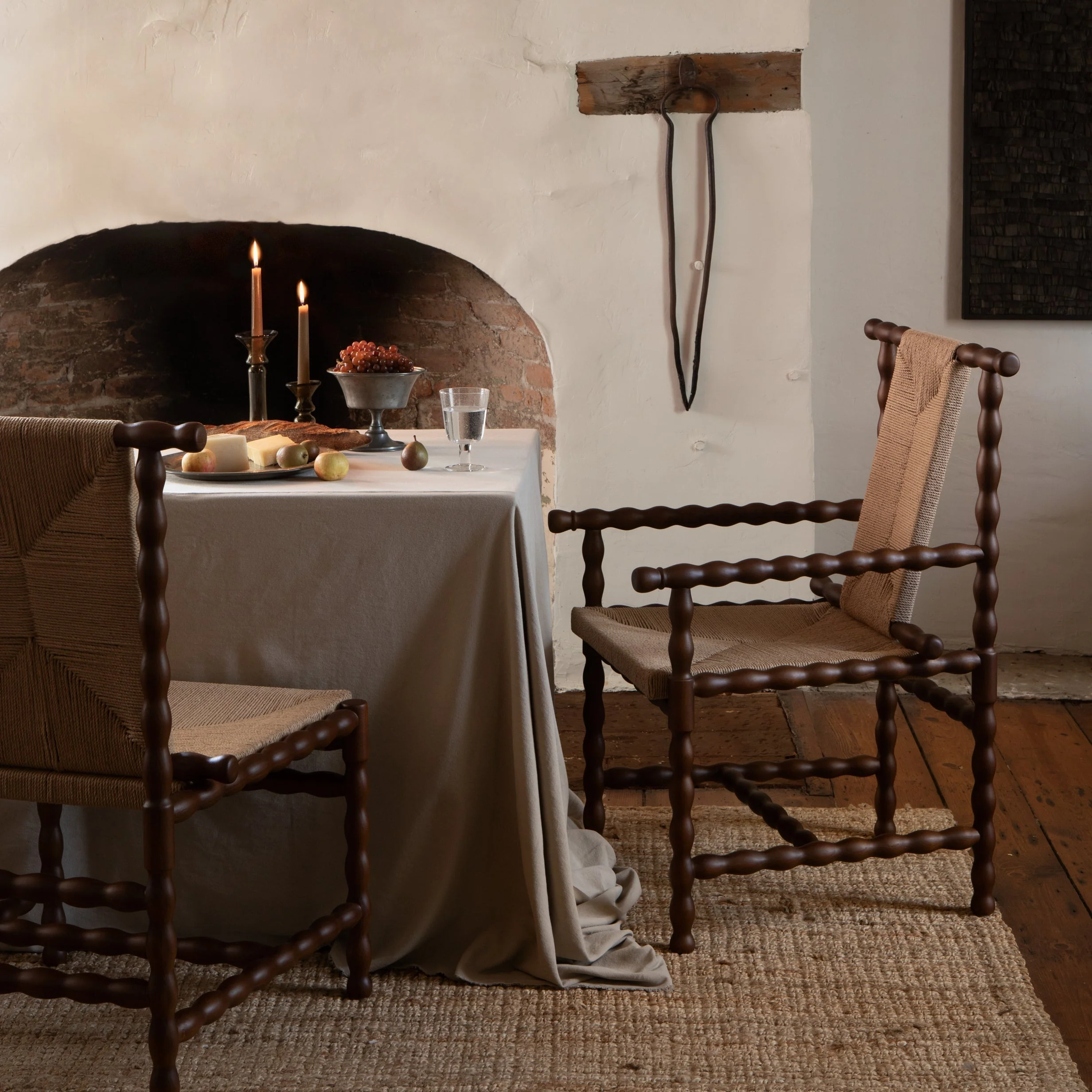Arm Chair - the craft traditions of turned wood and rush weaving, the exudes a refined, artisanal air