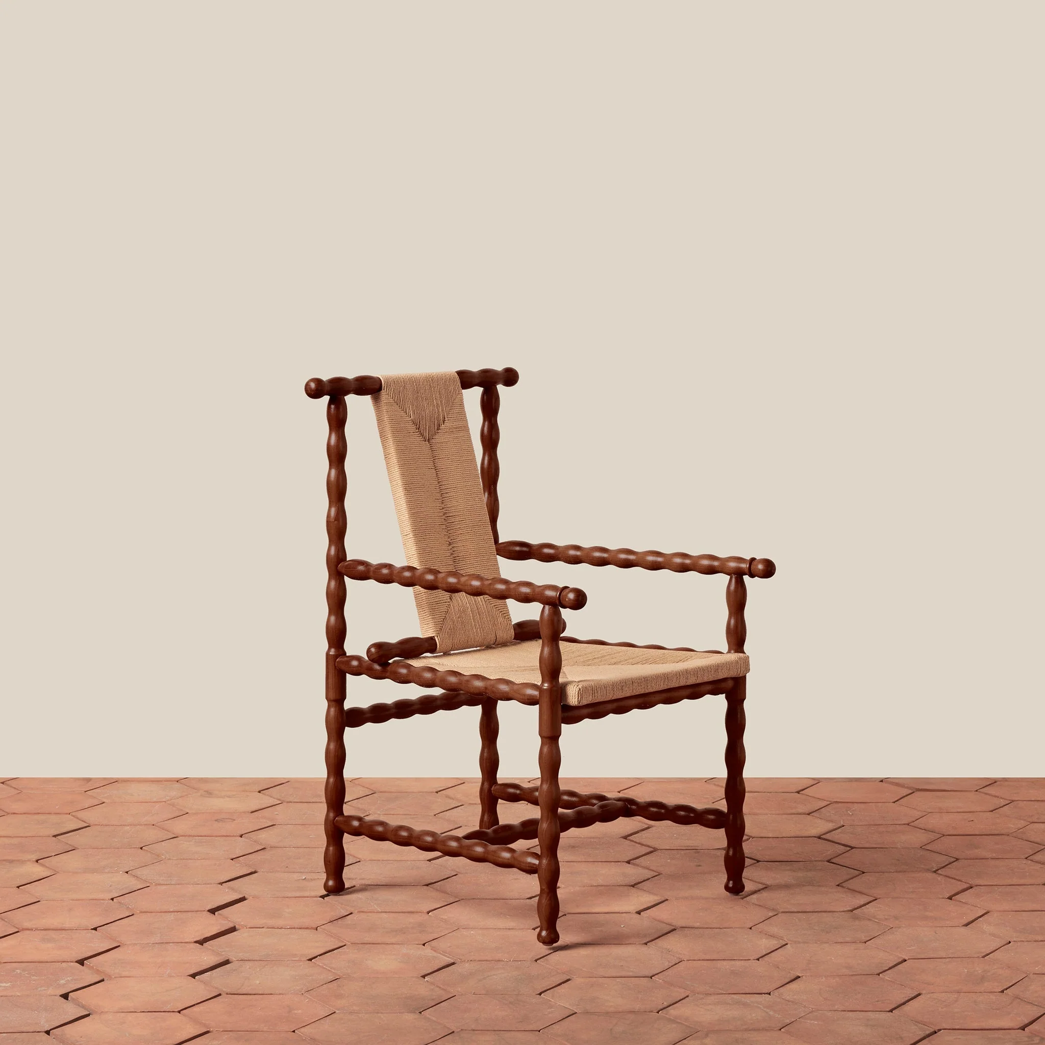 Arm Chair - the craft traditions of turned wood and rush weaving, the exudes a refined, artisanal air