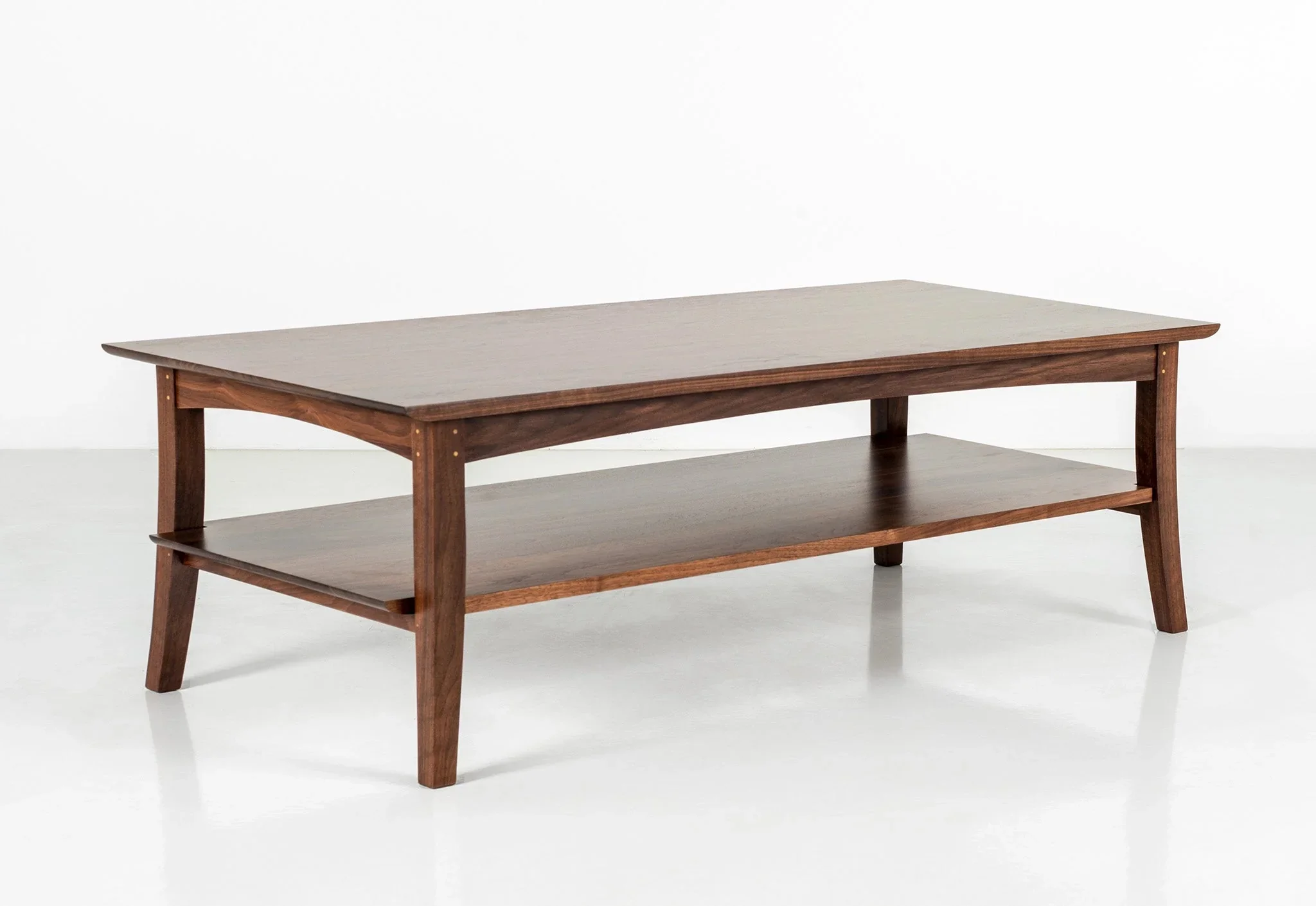 Coffee Table - Ideal for living spaces or conversational areas, the table has a simple notched shelf beneath the