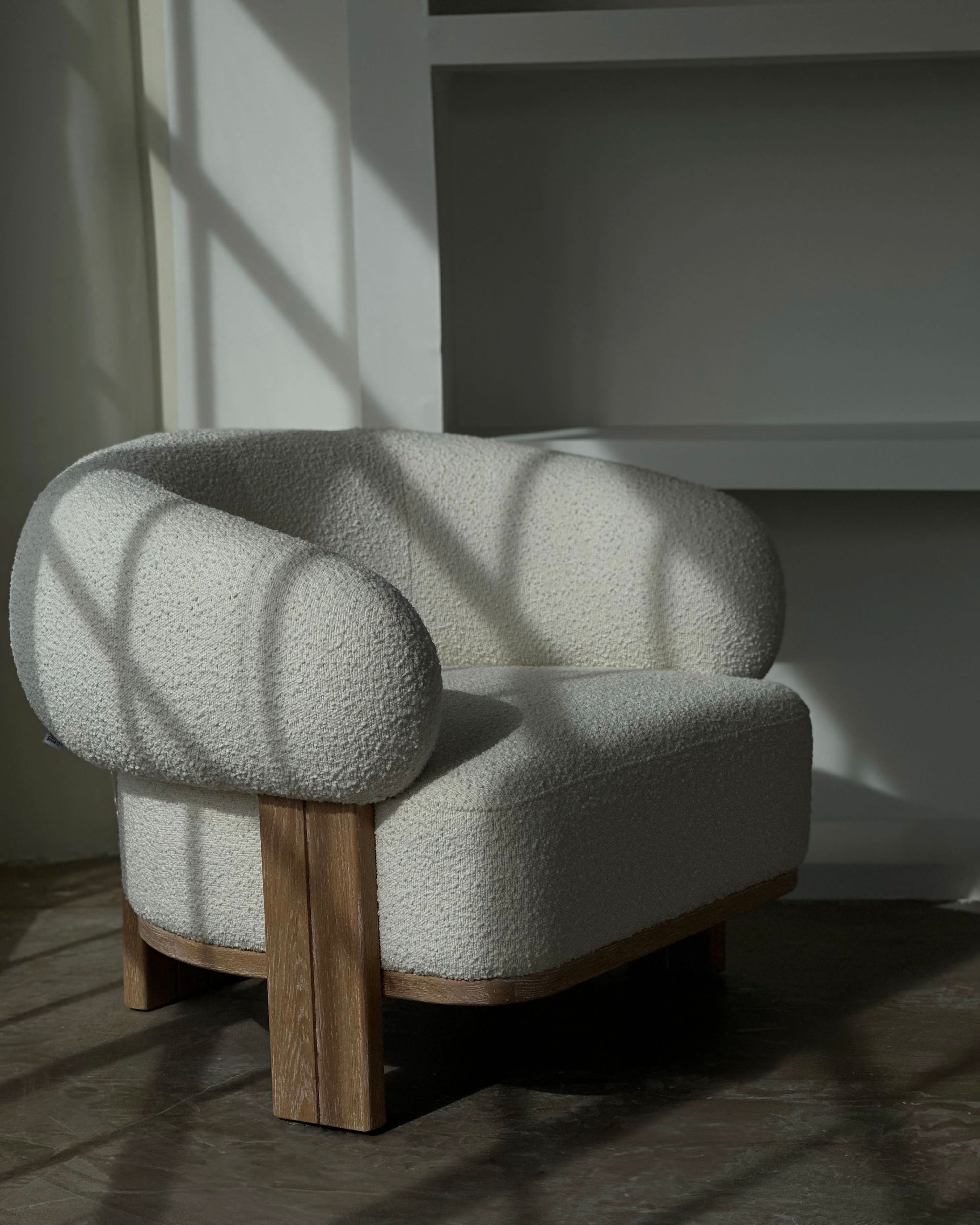 Chair - in sumptuous boucle fabric, composed of 95% polyester and 5% acrylic, the Chair boasts a creamy neutral hue that effortlessly enhances any...