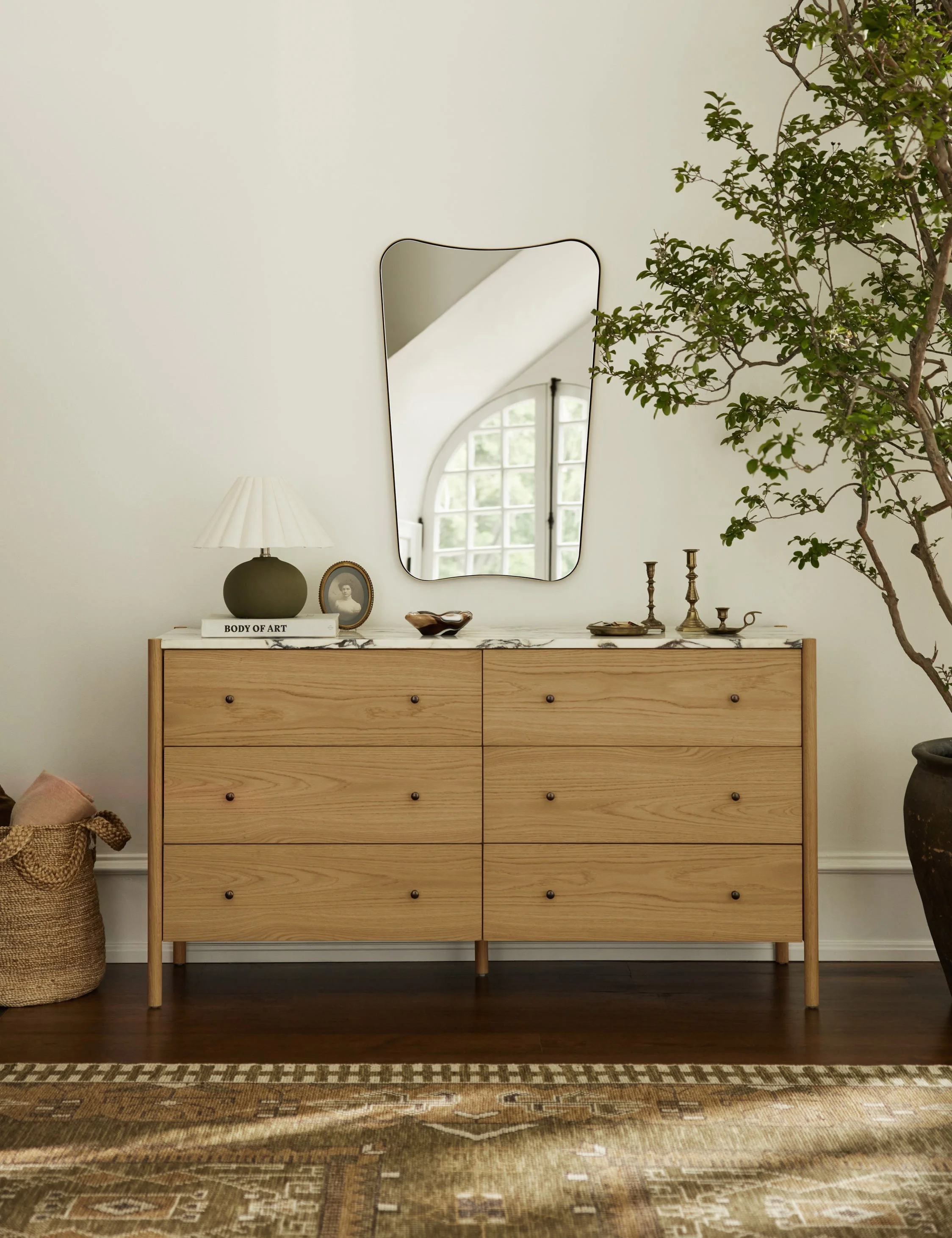 Dresser Our dresser brings a touch of polish to any bedroom edit. The wood frame showcases a beautiful natural grain, grounding the luxe marble top