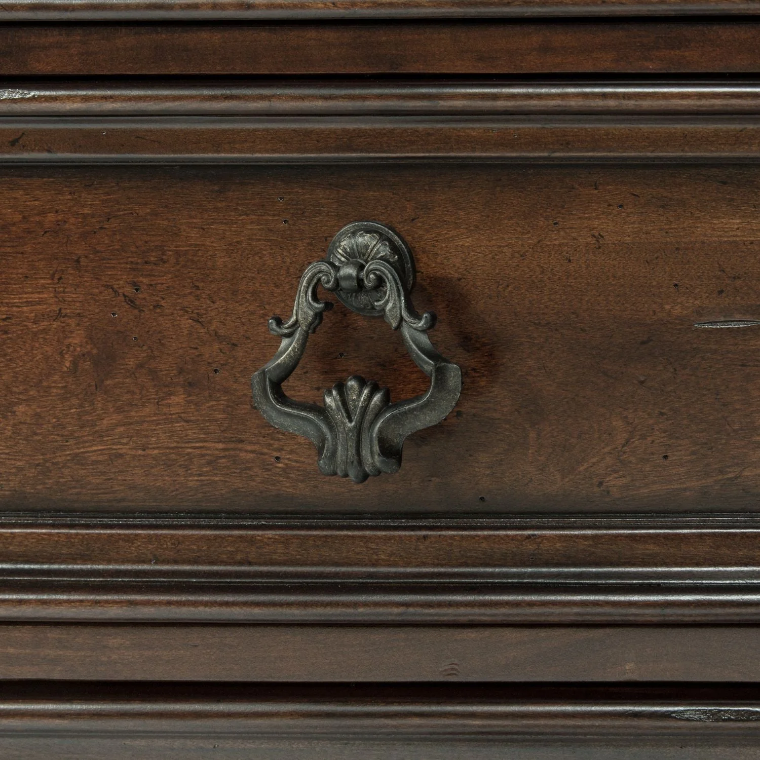 Dresser & Mirror - Brownstone — A combination of bold and dramatic scaling with soft shapes creates a casual traditional style
