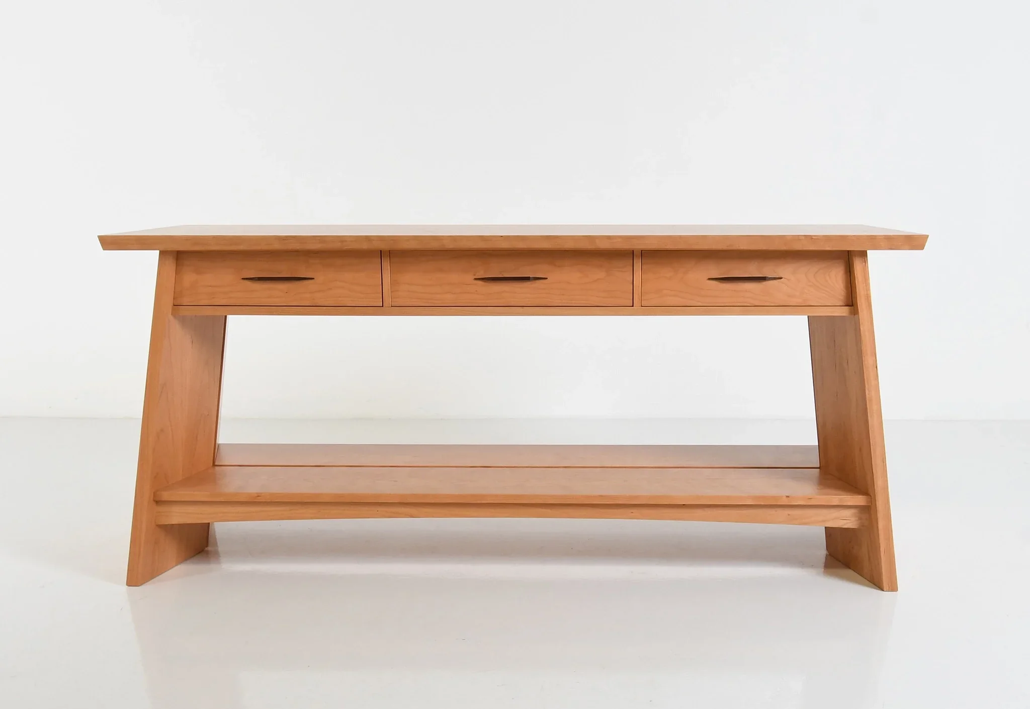 Open Sideboard - In addition to adding storage space, this piece offers strength and anchors the eye