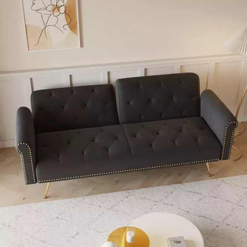 Black Velvet Fabric Sofa Featuring Nail Head Trim and Accompanied By A Matching Throw Pillow