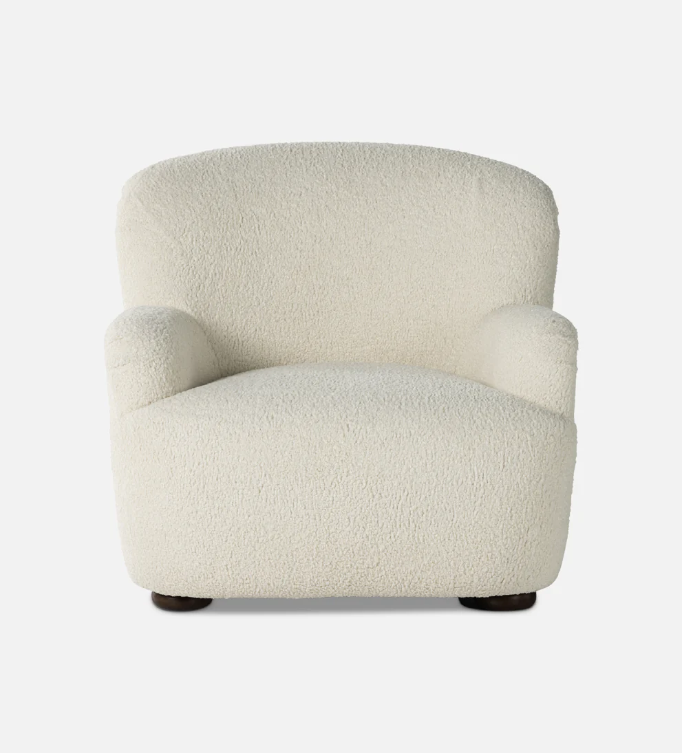Chair Natural - Add some trendy style to your home with our Chair. - Crafted from sheepskin and designed with a high wing back, this curvy