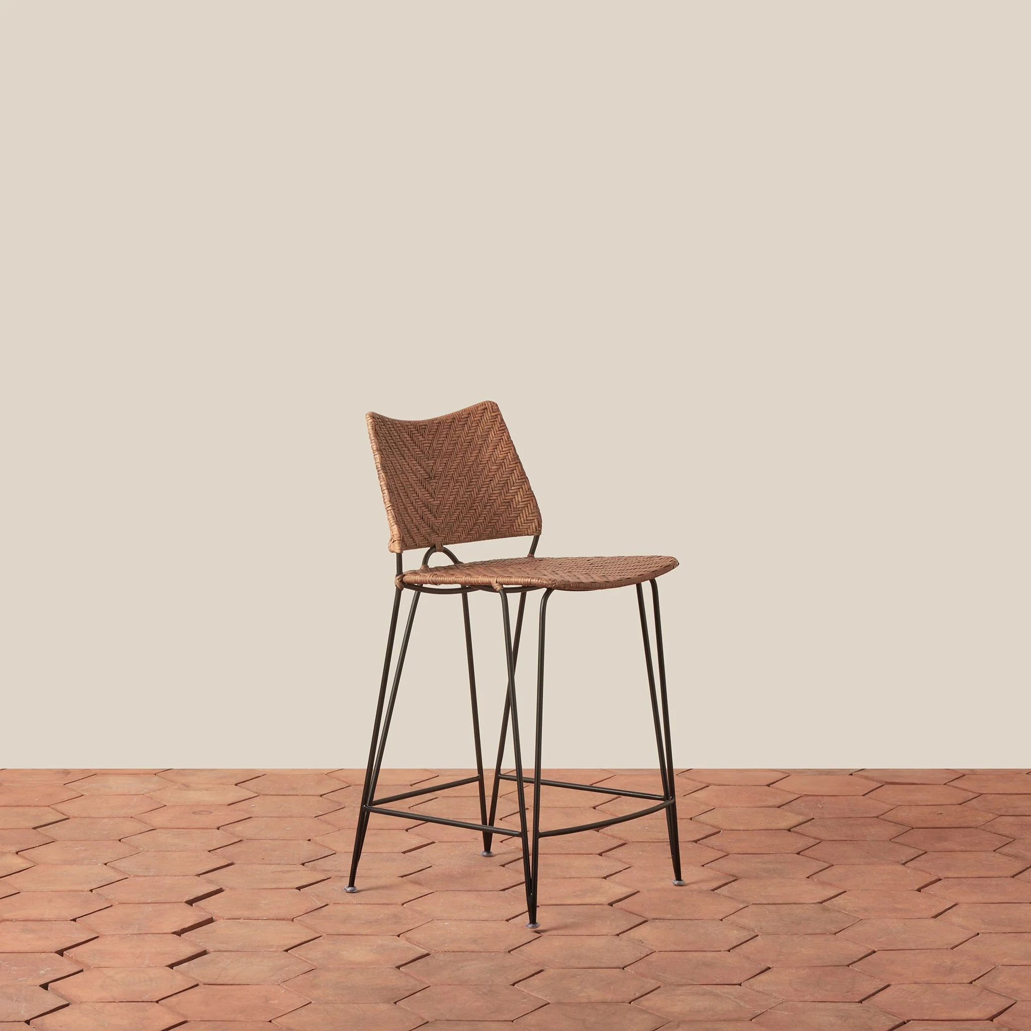 Counter Stool - With its graceful curved back and slender hairpin legs, the stool brings timeless architectural form to kitchen and counter spaces