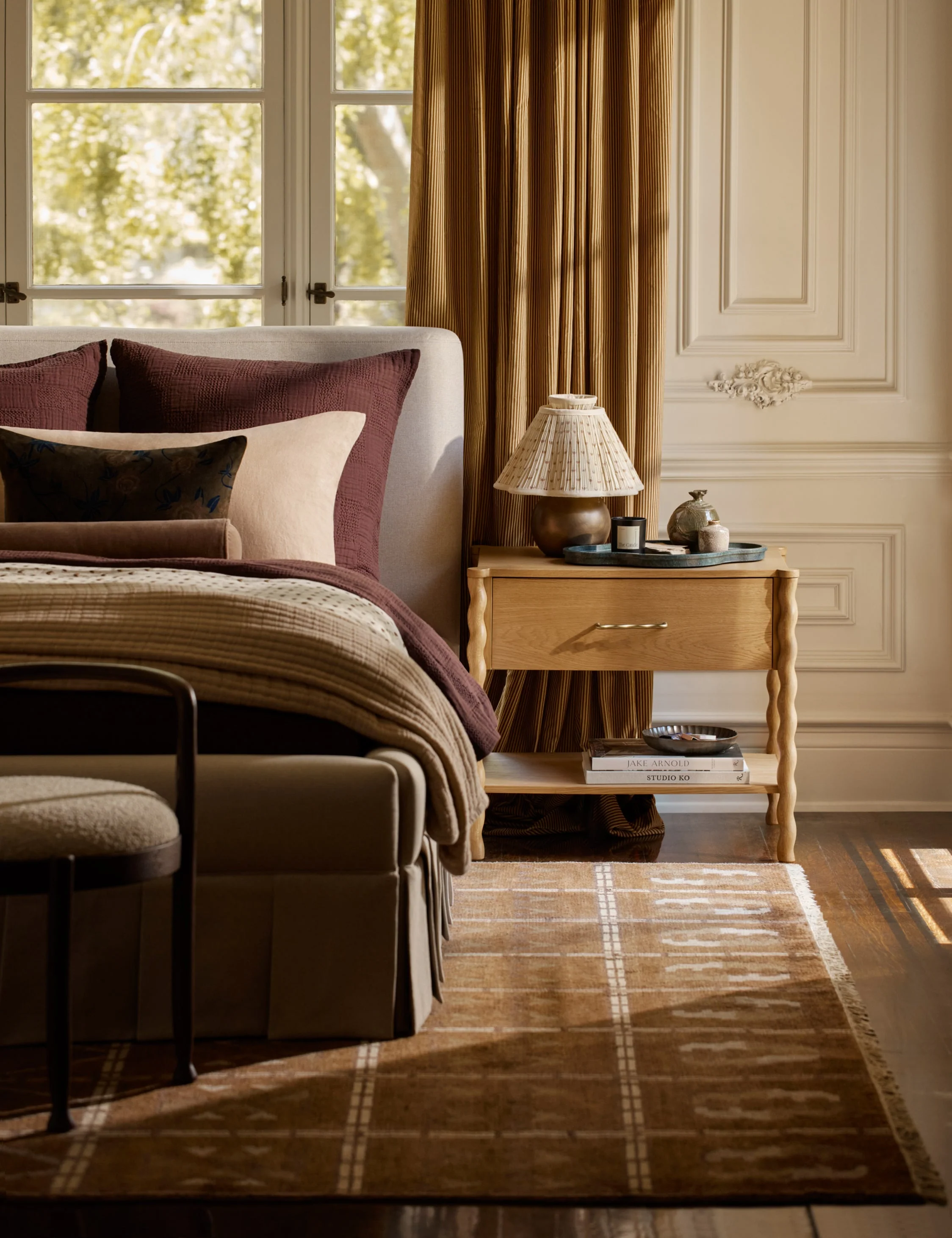 Nightstand Our nightstand offers natural grain texture with a twist. The clean wood silhouette is offset by turned legs and a wavy brass-finished