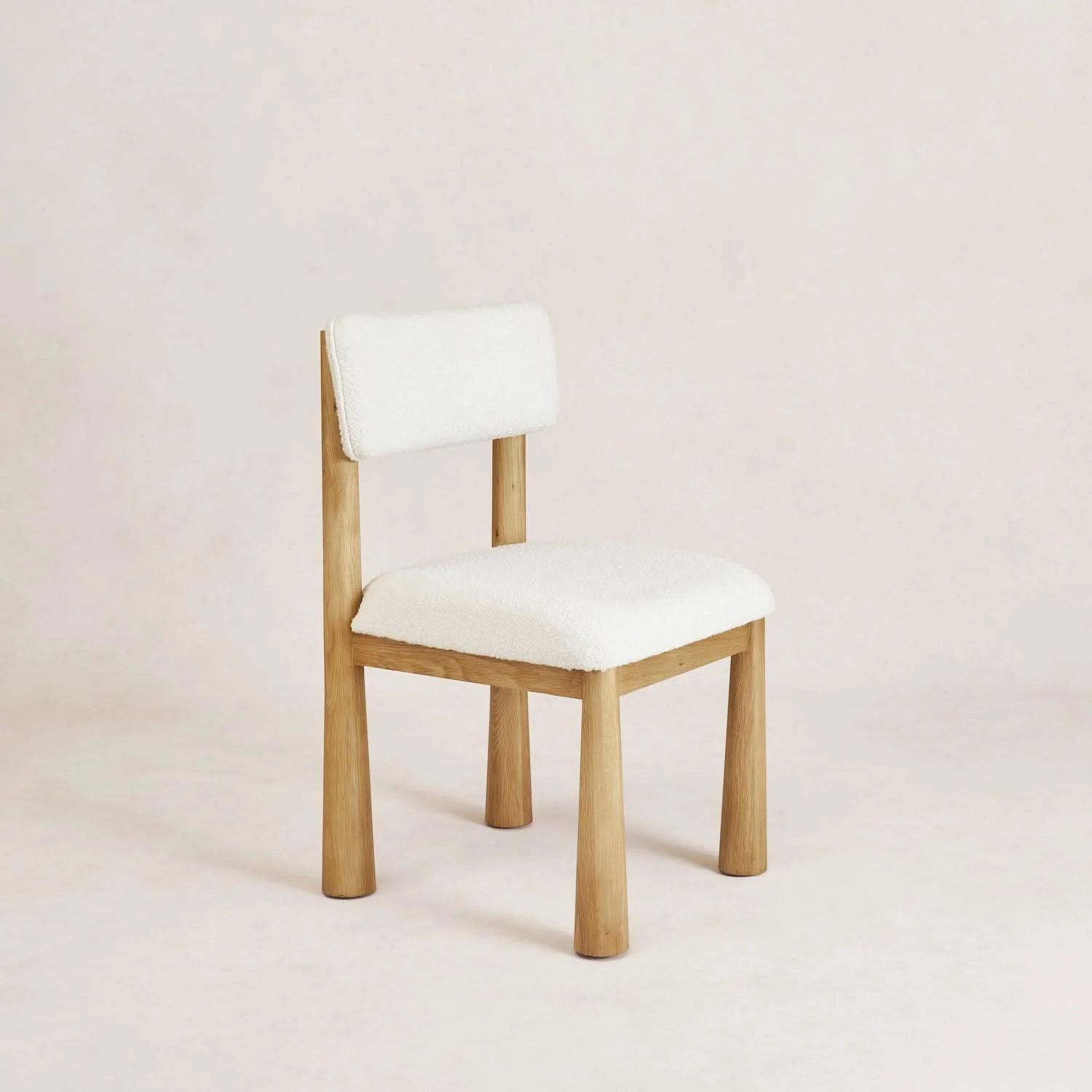 Dining Chair - Warm Oak - With tapered solid white oak legs and off-white boucle upholstery, the Dining Chair brings a young exciting look to your...