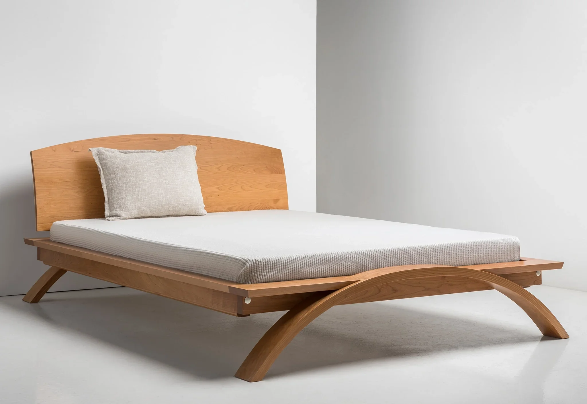 Bed - Taking good design down to the fundamentals, the simplicity and curved headboard harken back to the era, while