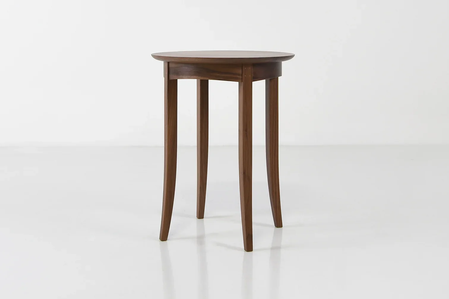 Wing End Table - Designed with the same fervent precision, the table can sit with elegance beside the Wing Chair