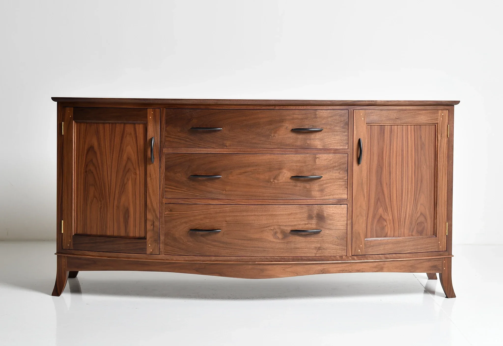 Sideboard - Inspired by a request for a curved adaptation of our linear case pieces, the integrates sweeping features