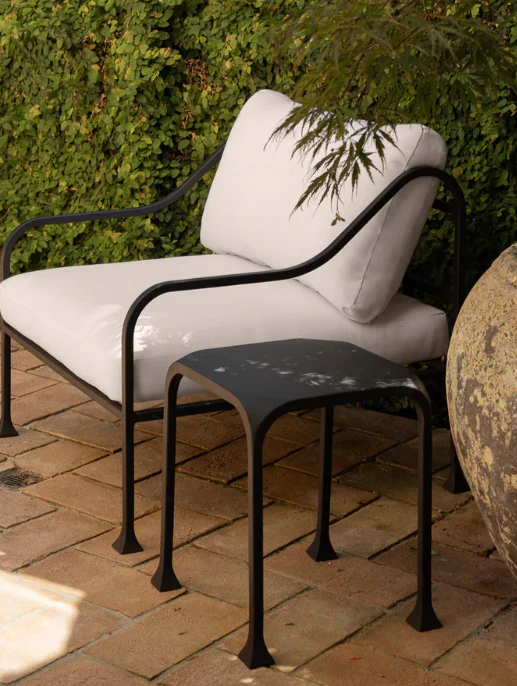 Outdoor Chair - chair flared feet with organic curved silhouette proportions for comfortable lounging construction for outdoor use by