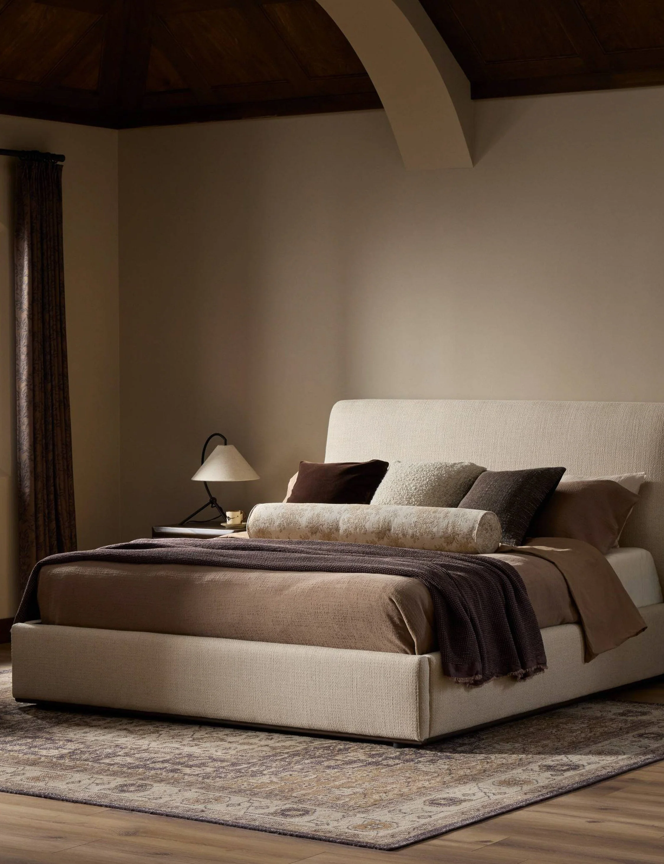 Platform Bed - With its gently curved headboard and streamlined shape, the bed offers a relaxed yet polished foundation for the bedroom