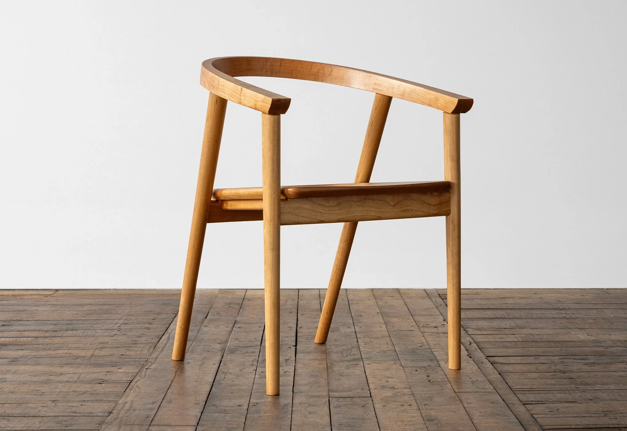 Chair - Due to the well-considered geometry of the seat and the relationship to the continuous arm and crest rail, the