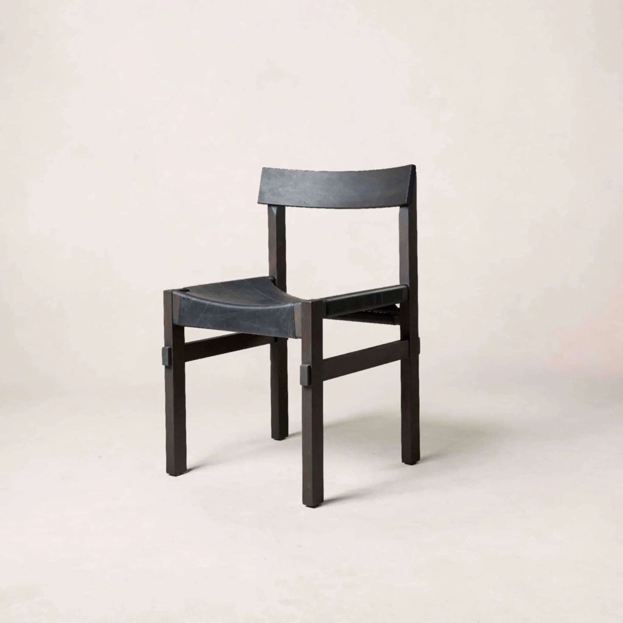 Dining Chair - Black - The thick leather, along with the handcrafted frame and a curved backrest, offer exceptional comfort and an eye-catching...