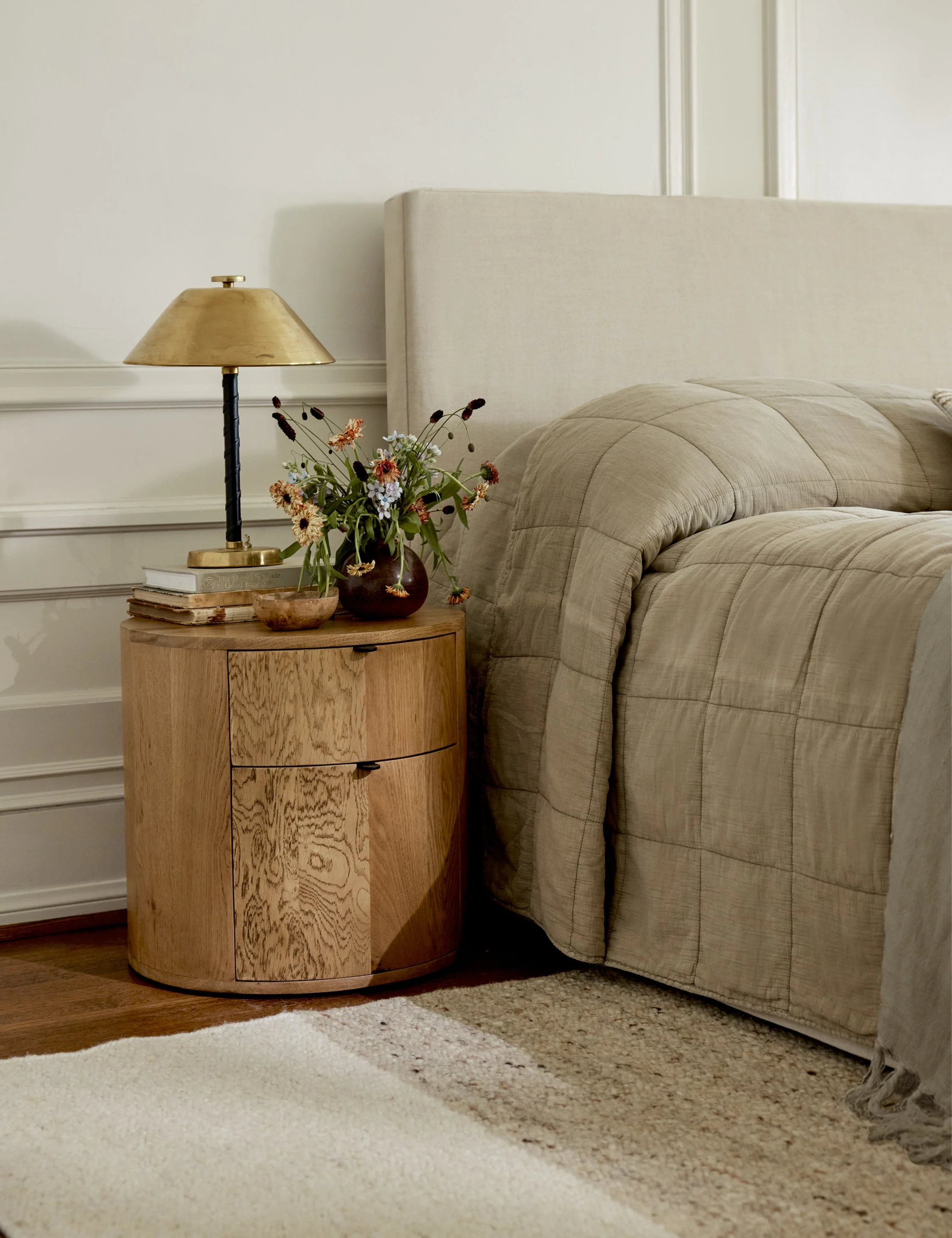 Nightstand Crafted from solid oak, the Nightstand is a beautifully versatile piece for your bedroom. This bedside table's curved silhouette creates