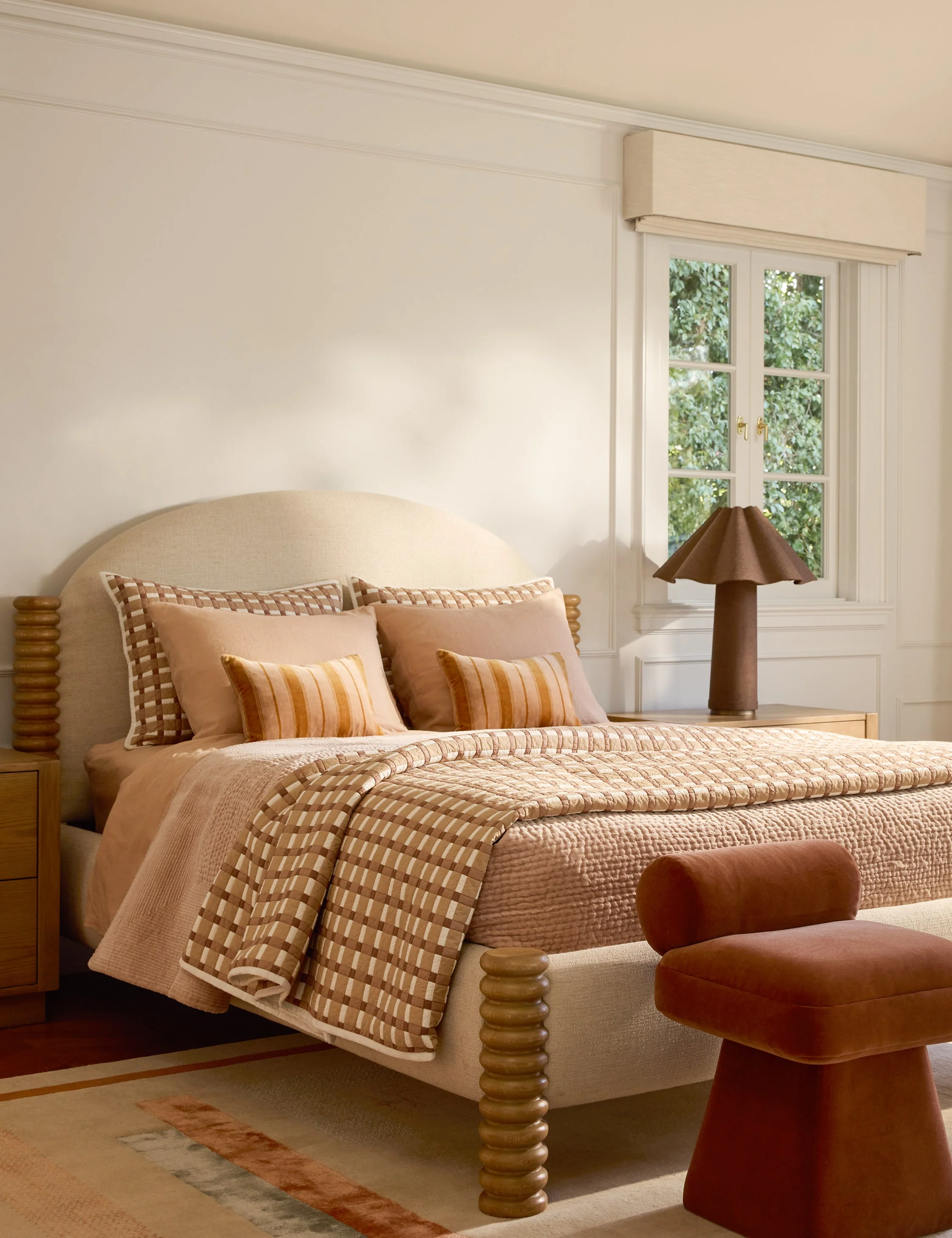 Bed - An arched headboard and turned wood legs give our bed a playful yet sophisticated presence