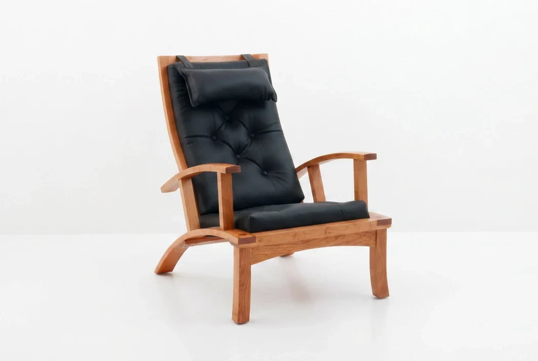 Chair - Shaped to emulate the curvature of the human form and cushioned in silky-soft tufted leather, the aptly-named