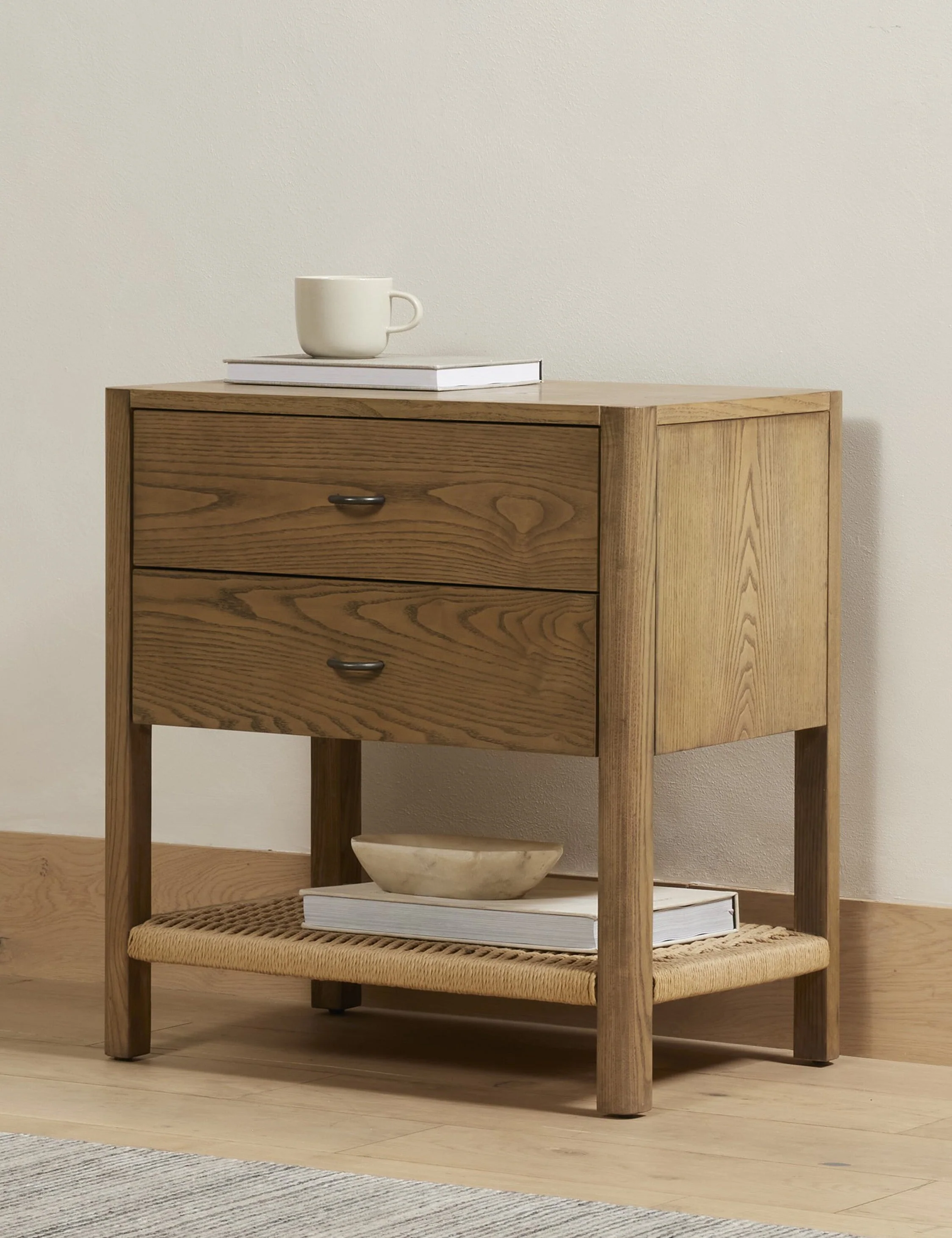 Nightstand A clean-cut, ash wood design brings Danish-inspired warmth to this nightstand. Iron arch pulls complete the look, while a woven cord
