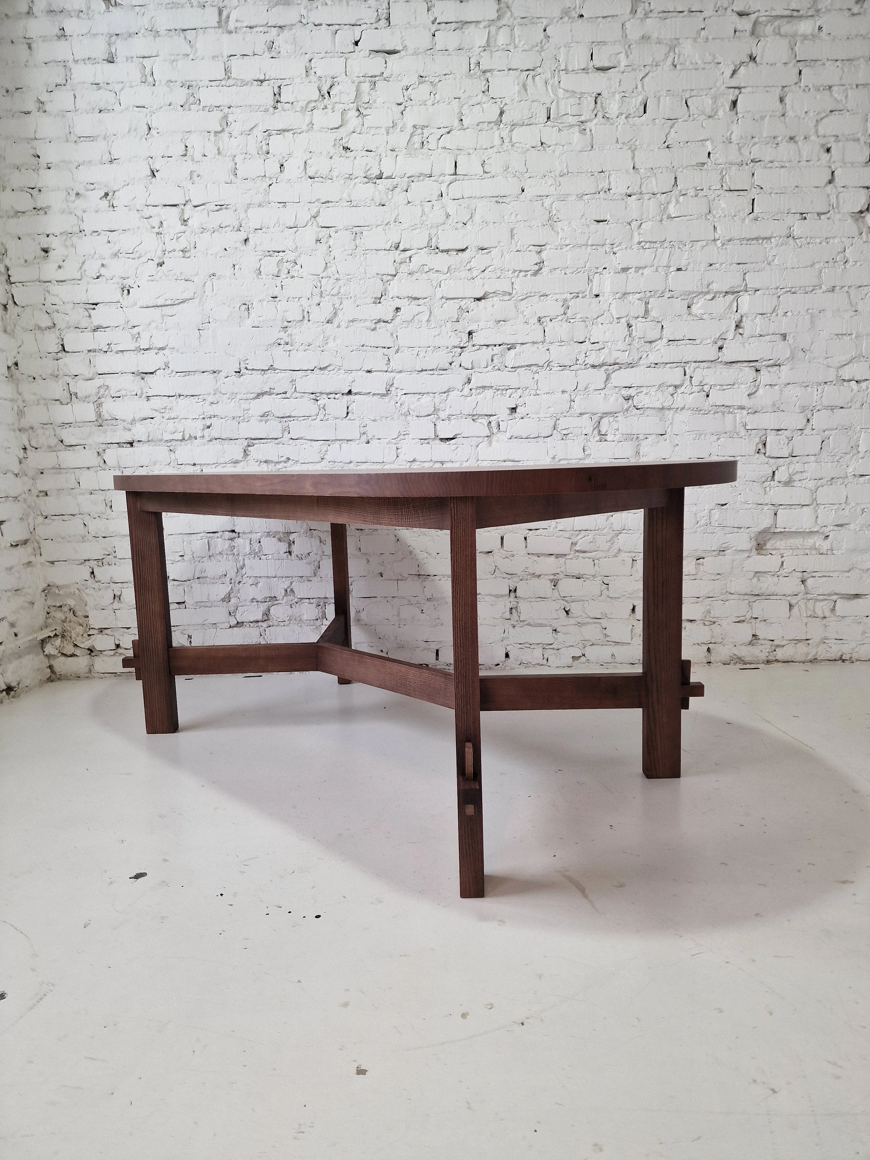 Oval Dining Table in Solid Oak - Introducing the dining oak table - made of solid wood and covered with chocolate oil - a piece that