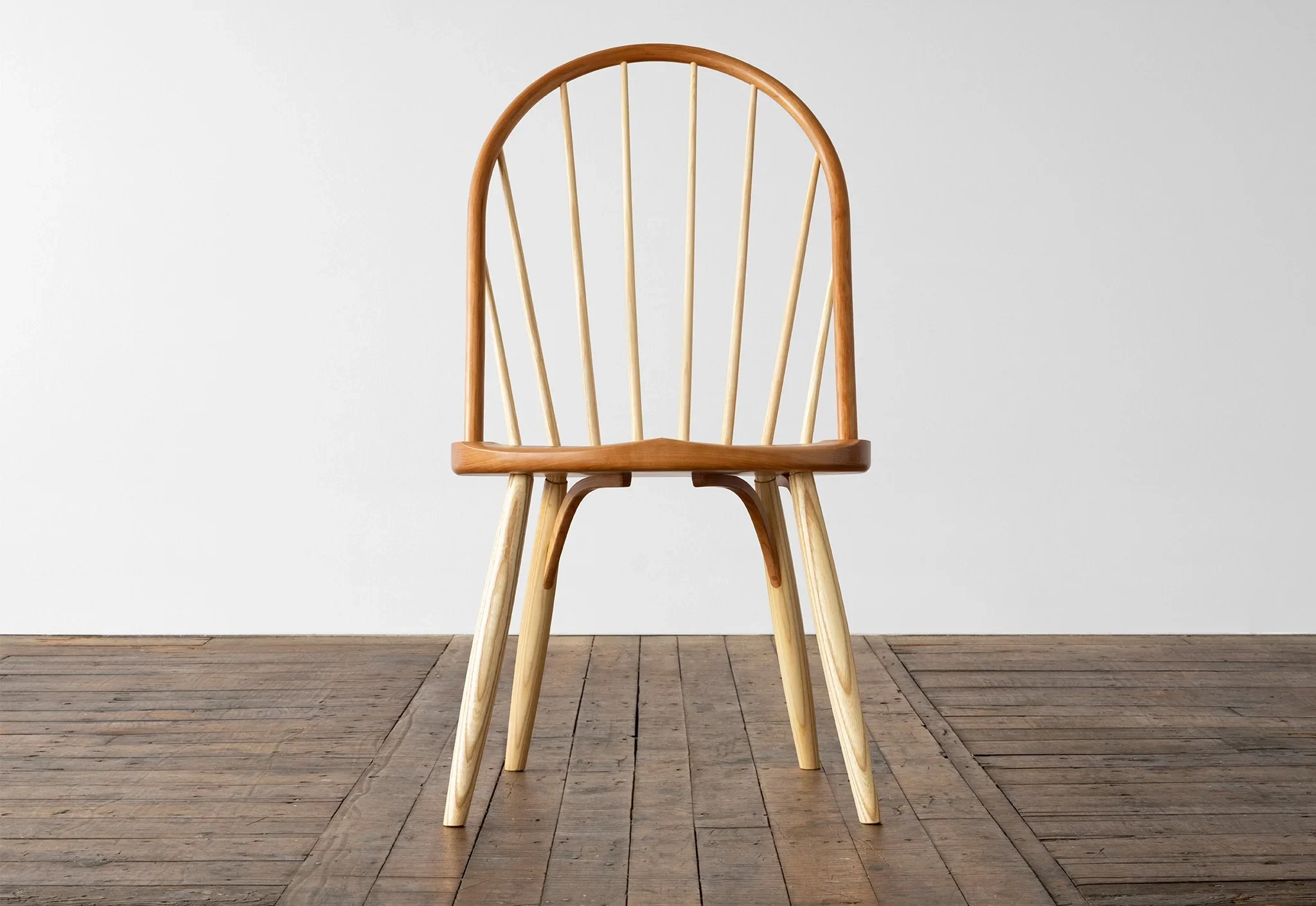 Bowback Chair - Distinctive for its unique flitch laminated bow, which arcs over eight slender ash spindles, the chair