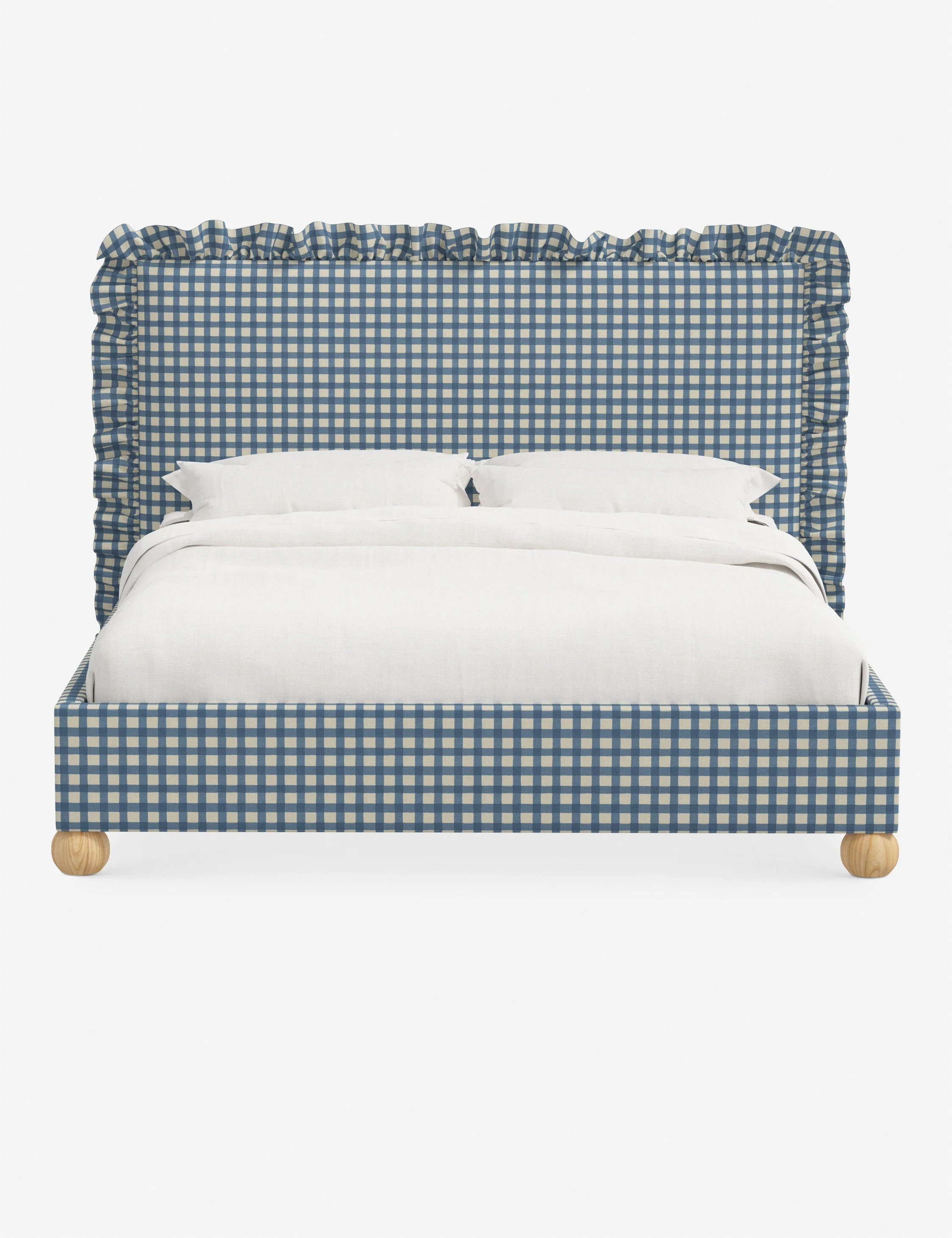 Bed We love a bed that exudes soft elegance. The bed brings a classic touch of texture to the room with its ruffled headboard and wooden