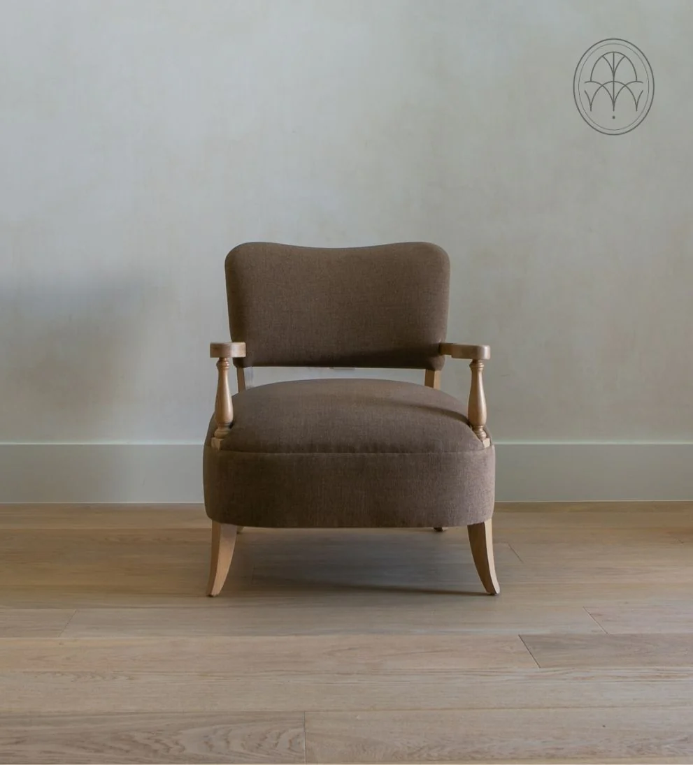 Lounge Chair - Traditional meets contemporary in the Lounge Chair. - I love the curved arms and turned wood spindles of this chair.