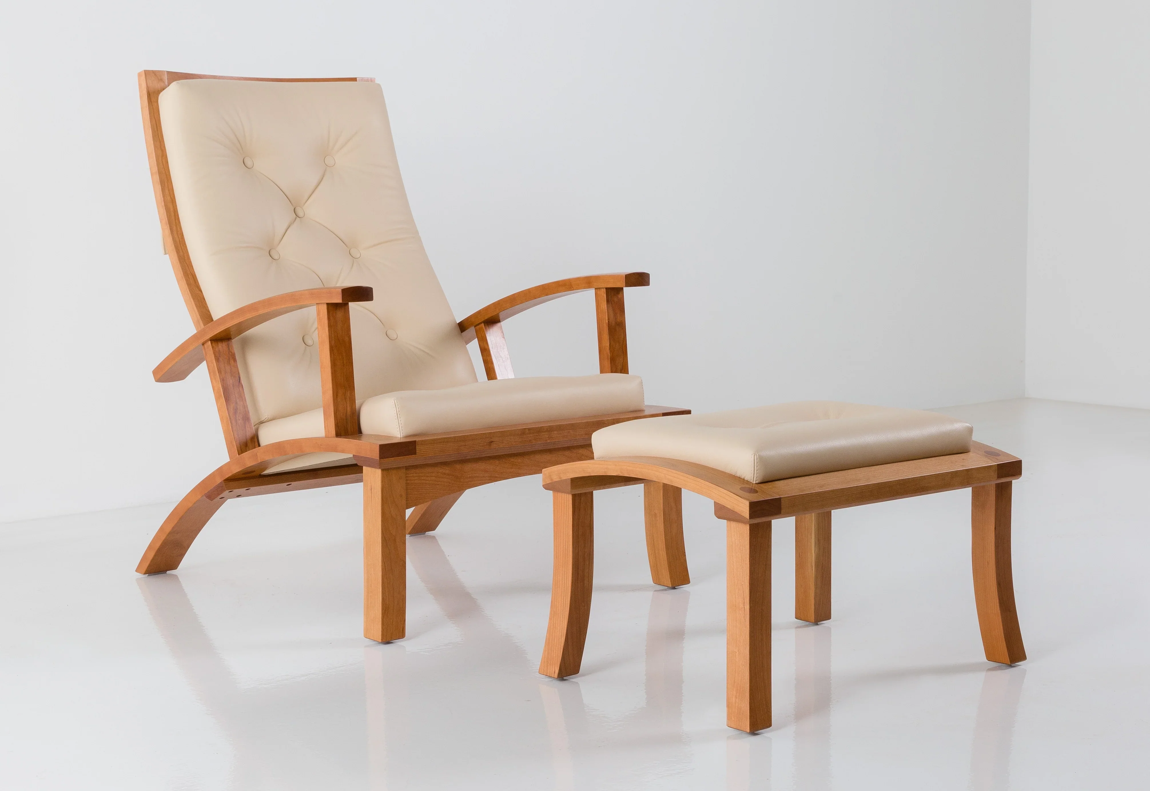 Chair - Shaped to emulate the curvature of the human form and cushioned in silky-soft tufted leather, the aptly-named