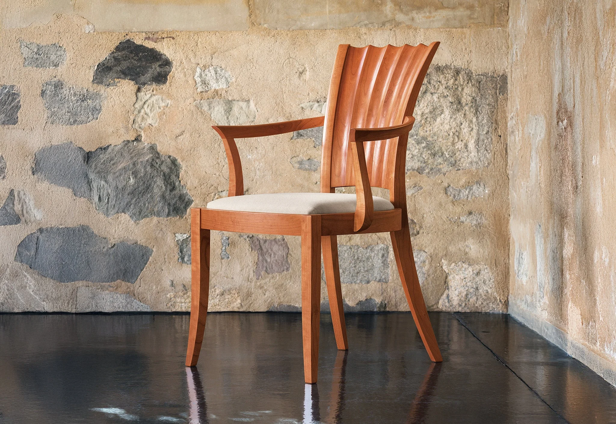 Arm Chair - The hourglass lines of the – seen in the hand-carved convex and concave curves of its distinctive back