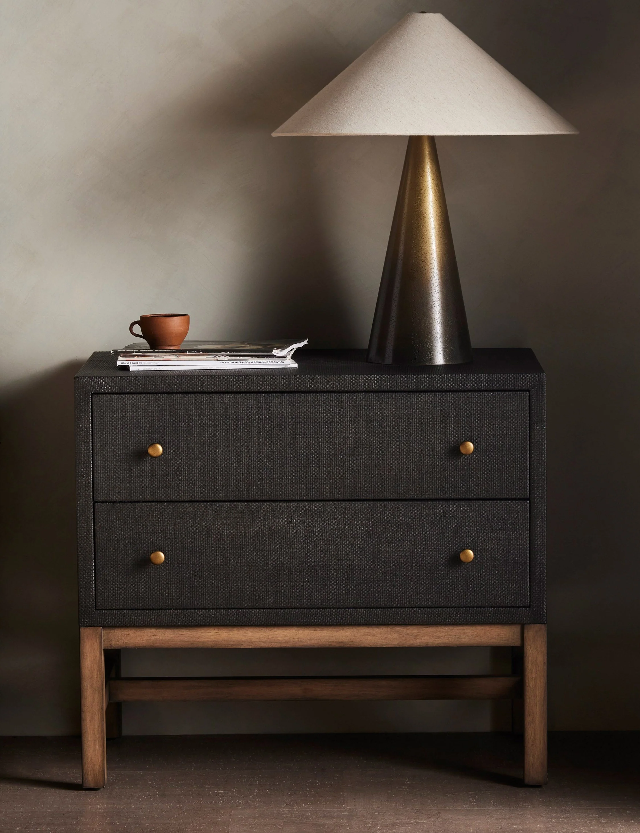 Nightstand This woven raffia nightstand offers textural impact with a clean, linear silhouette. The two-tone finish of the black raffia against