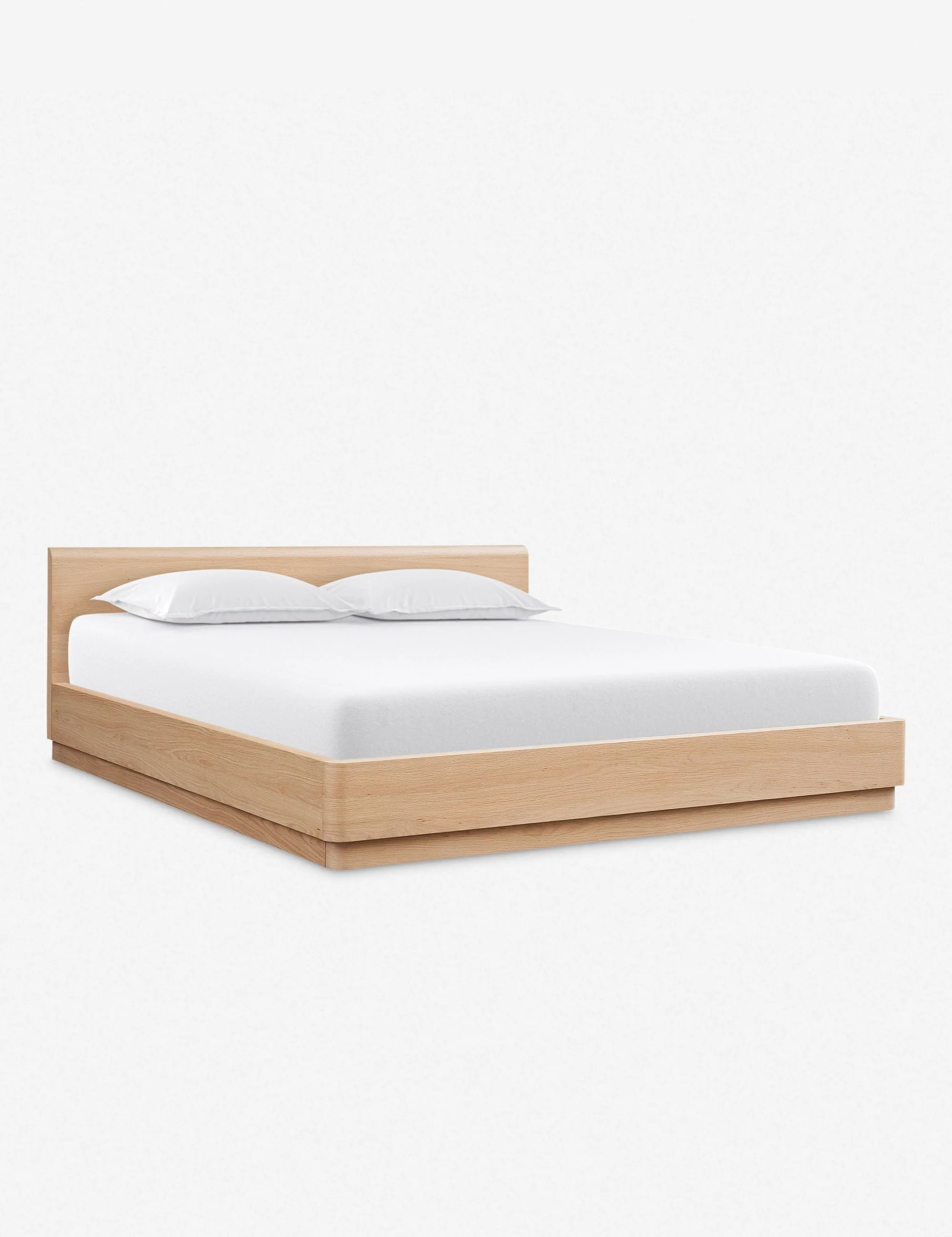 Bed A beautiful platform bed from the Collection featuring solid oak construction with softly molded corners and a low-slung design. Clean, gentle